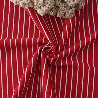 Un buen precio. Tejido de punto de algodón puro con rayas, de color combinado. Tejido de rayas para jersey. en línea